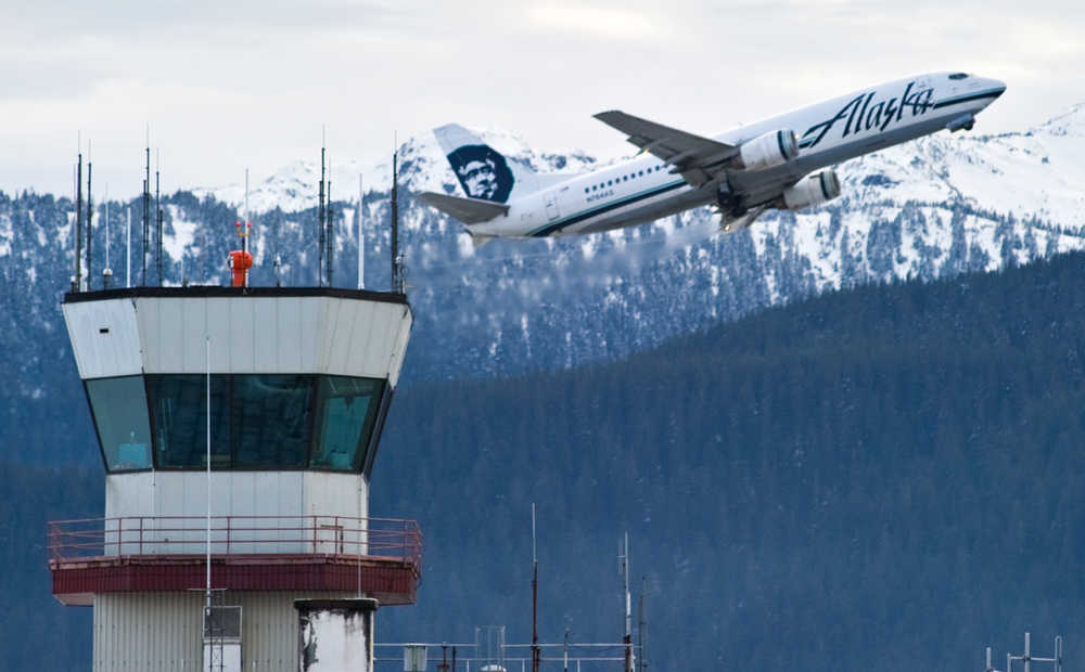 An Alaska Airlines cargo/passenger jet lifts off from the Juneau International Airport on Friday.