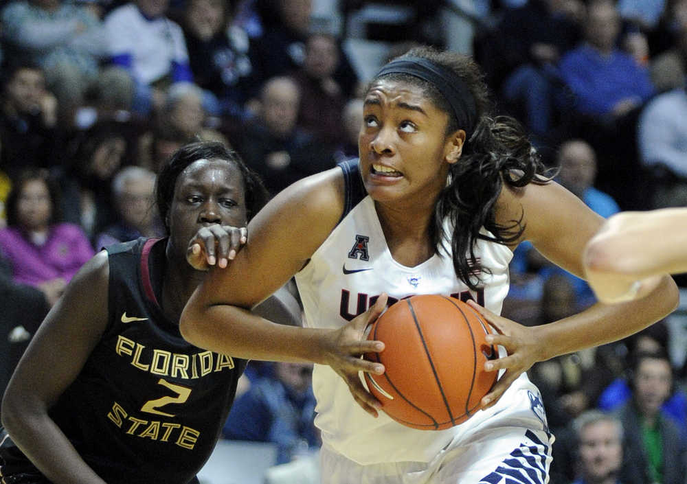 Connecticut's Morgan Tuck drives past Florida State's Audut Bulgak on Friday.