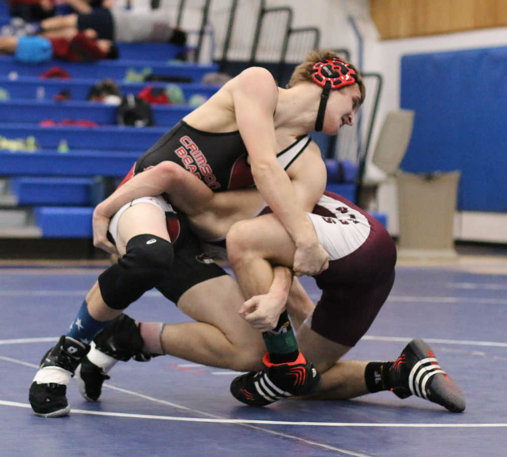 Juneau-Douglas High School wrestler Tucker Joeright and Justin Albecker of Ketchikan wrestle in Petersburg last weekend during the regional tournament. Joeright won the match 13-11 but lose in the 138-pound championship. He is among nine wrestlers competing at the state tournament this weekend.
