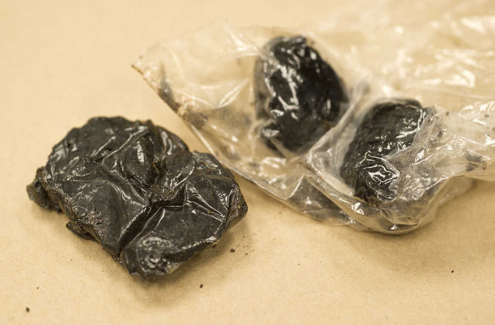 A collection of 52.20 grams of black tar heroin photographed at the Juneau Police Department.