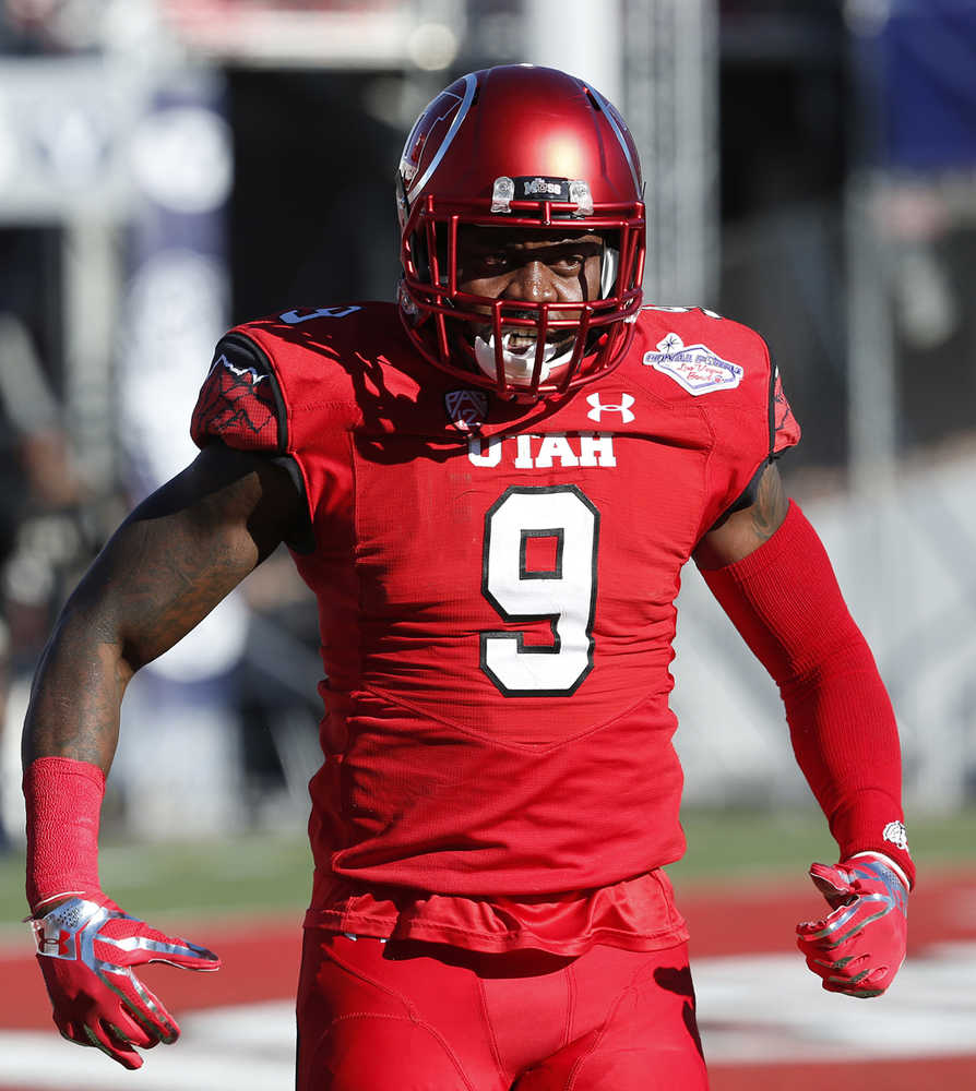Utah defensive back Tevin Carter  celebrates after he made an interception to score against BYU during the Las Vegas Bowl Saturday.