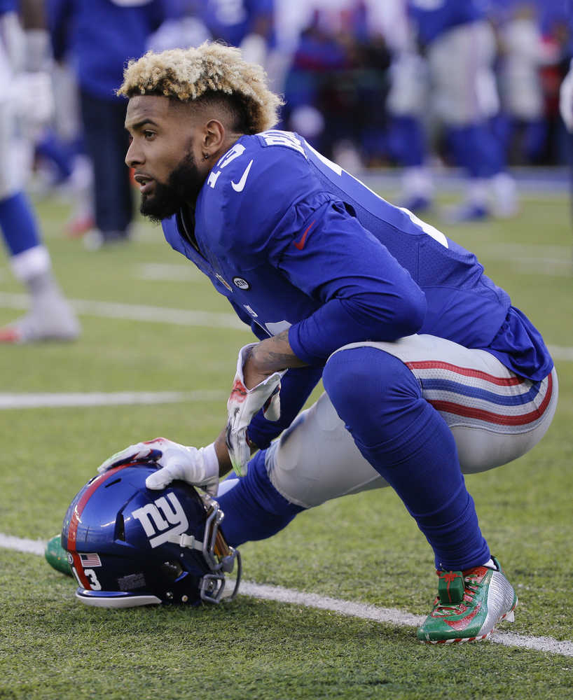 New York Giants wide receiver Odell Beckham (13) stretches with teammates before an NFL football game against the Carolina Panthers, Sunday, Dec. 20, 2015, in East Rutherford, N.J. (AP Photo/Julie Jacobson)
