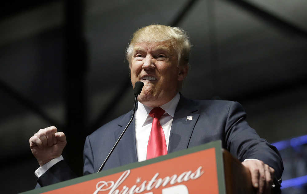 Republican presidential candidate, businessman Donald Trump addresses supporters at a campaign rally, Monday, Dec. 21, 2015, in Grand Rapids, Mich. (AP Photo/Carlos Osorio)
