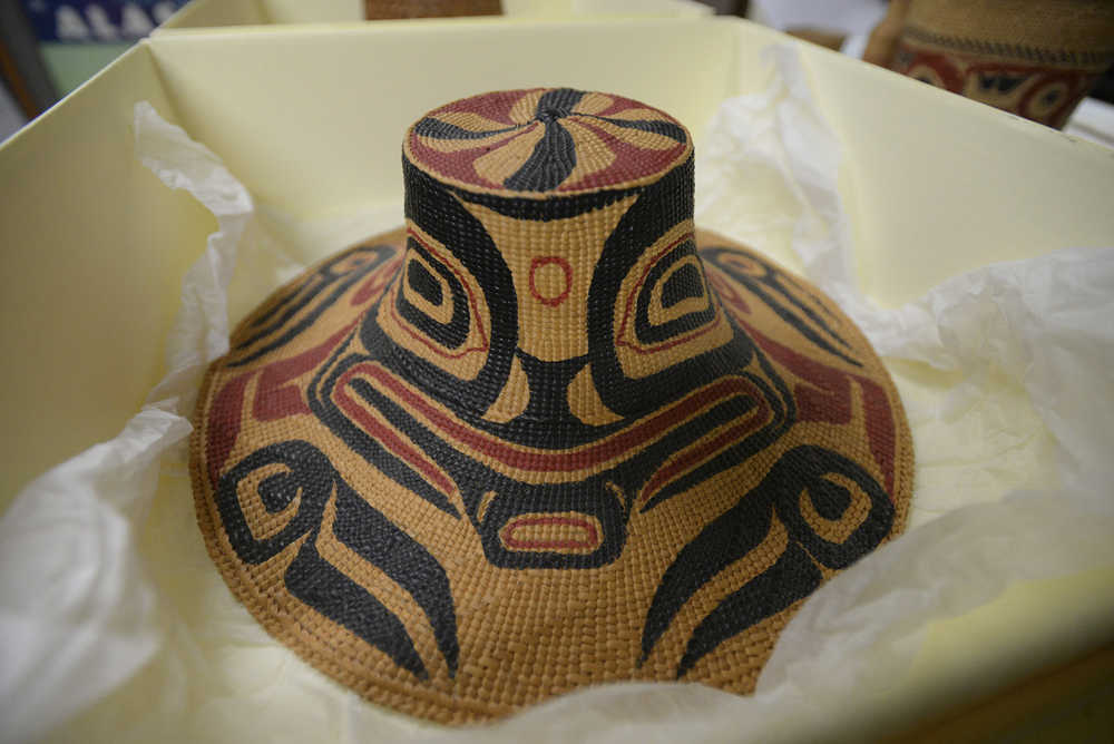 In this Dec. 17 photo, a spruce root hat, weaved by Selina Peratrovich and painted by Nathan Jackson, sits in a box in the Tongass Historical Museum storage room in Ketchikan.