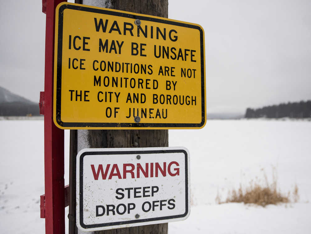 Warning signs posted at the edge of Twin Lakes alert skaters that the ice is not monitored by the City and Borough of Juneau.