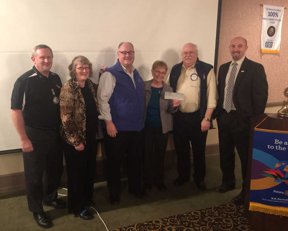 Accepting a check from Rotary President John Blasco, right, are members of the United Way of Southeast Alaska board, from left, Warren Russell, Millie Ryan, Bill Peters, Robbie Stell and United Way President and CEO Wayne Stevens.