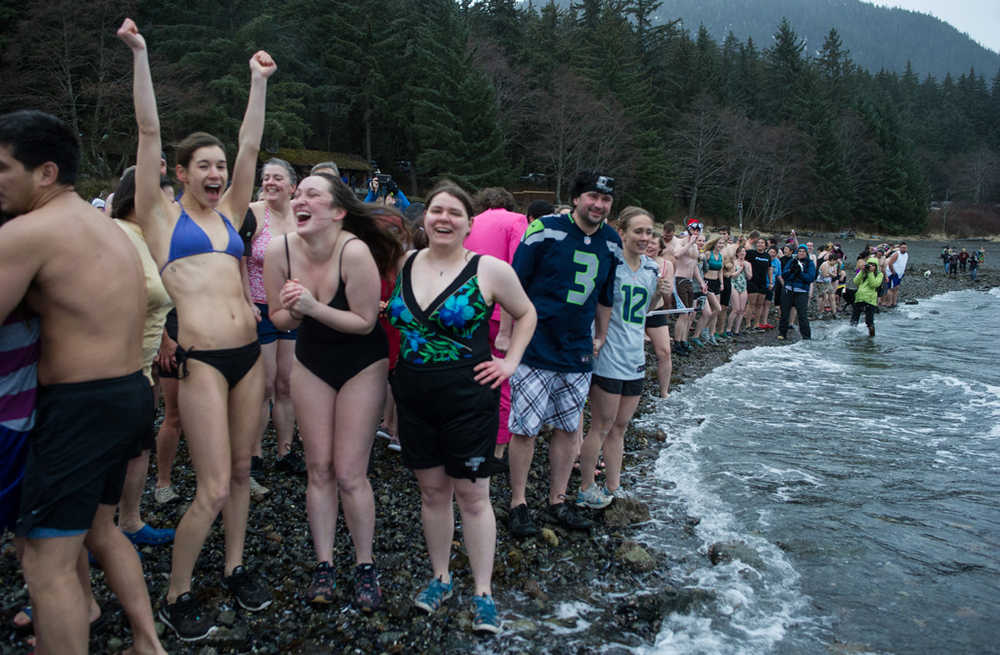 Swimmers wait with excitement before the 24th annual Polar Bear Dip at the Auke Village Recreation Area on Friday, Jan. 1, 2016.