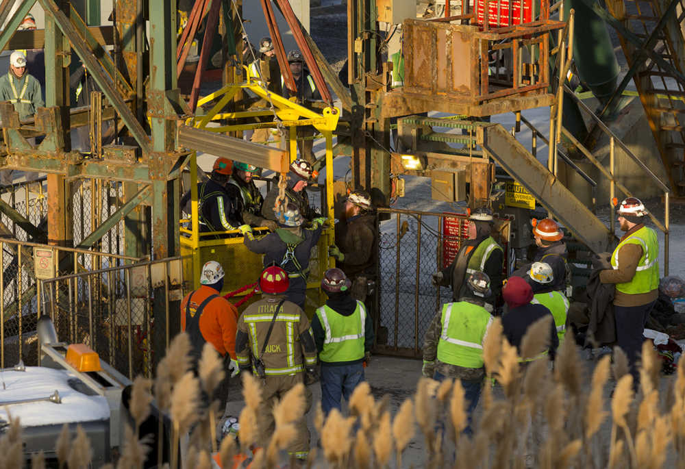 The last of 17 Cargill salt miners emerge Thursday after being rescued from an elevator stuck 900 feet below the surface at the Cayuga Salt Mine in Lansing, New York.