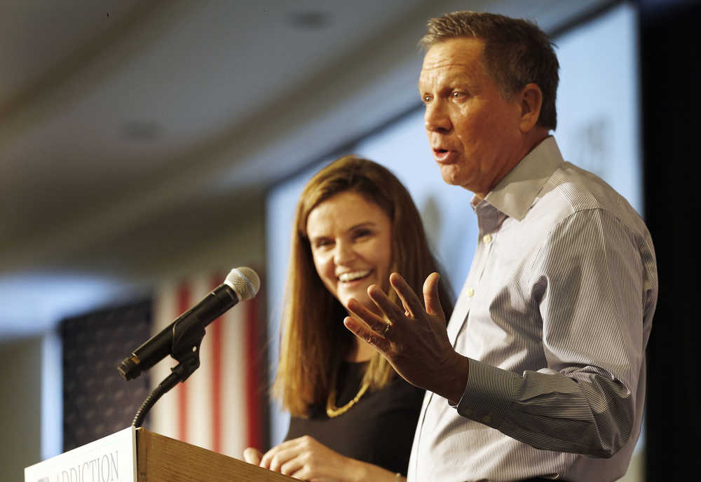 Republican presidential candidate, Ohio Gov. John Kasich, accompanied by Jessica Nickel, speaks during a stop at an Addiction Policy Forum on Jan. 5 in Hooksett, New Hampshire.