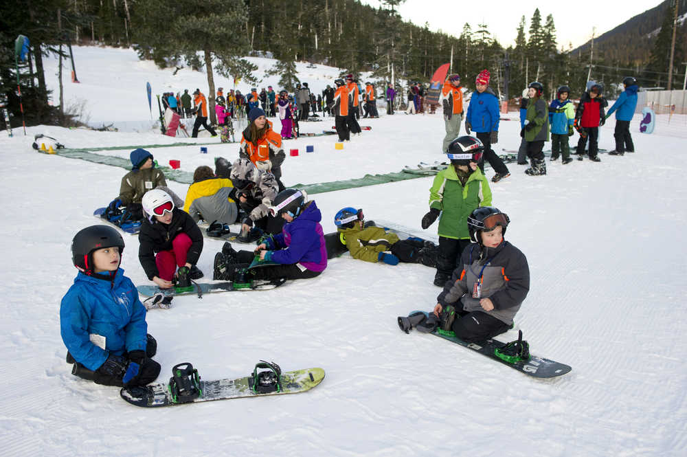 Students of all ages gather to participate in the the World's Largest Lesson at Eaglecrest on Friday as part of Learn to Ski and Snowboard Month. The event, that included 80 participants and 17 instructors, was part of a national attempt to break a Guinness World Record.