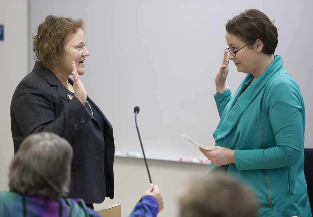 Barbara Sheinberg, left, is sworn in by city attorney Amy Mead after a special meeting to vote Sheinberg to fill the open District 1 Assembly seat.