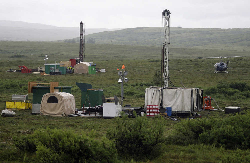 In this July 13, 2007 photo, workers with the Pebble Mine project test drill in the Bristol Bay region near the village of Iliamma.