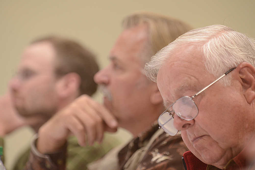 In this July 21, 2013 photo, Roland Maw takes notes during a hearing on the Magnuson Stevens federal fisheries management act in Kenai. On Wednesday, Maw was charged with falsifying his Alaska residency on 17 counts.