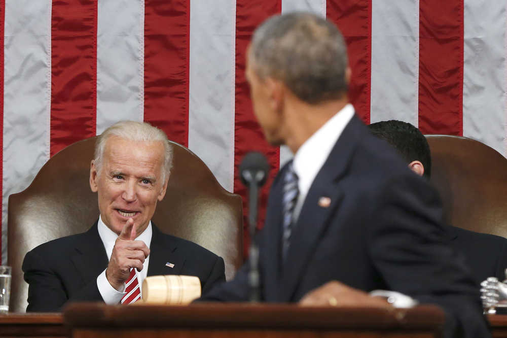 FILE - In this Jan. 12, 2016 file-pool photo, Vice President Joe Biden points at President Barack Obama during the president's State of the Union address to a joint session of Congress on Capitol Hill in Washington. Harking back to America's triumphant race into space, the Obama administration is launching what it calls a "moonshot" effort to cure cancer. Don't expect miracles in the president's last months, but there has been striking progress in recent years. (AP Photo/Evan Vucci, Pool, File)