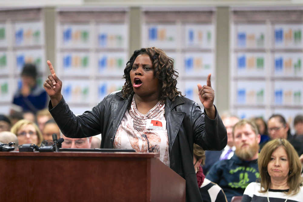 ADVANCE FOR USE MONDAY, JAN. 18, 2015 AND THEREAFTER - In this Jan. 4, 2016 photo, Gwen Easter testifies before an Omaha Public Schools board meeting in Omaha, Neb. Easter, who runs a community center and preschool program, assailed the proposals to teach acceptance and understanding of gay and transgender youth. "That's the real agenda _ the same-sex stuff," she declared during remarks that drew cheers from her allies in the crowd. (AP Photo/Nati Harnik)