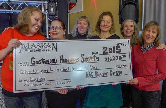 Alaskan Brewery crew presents Gastineau Humane Society members donation check.