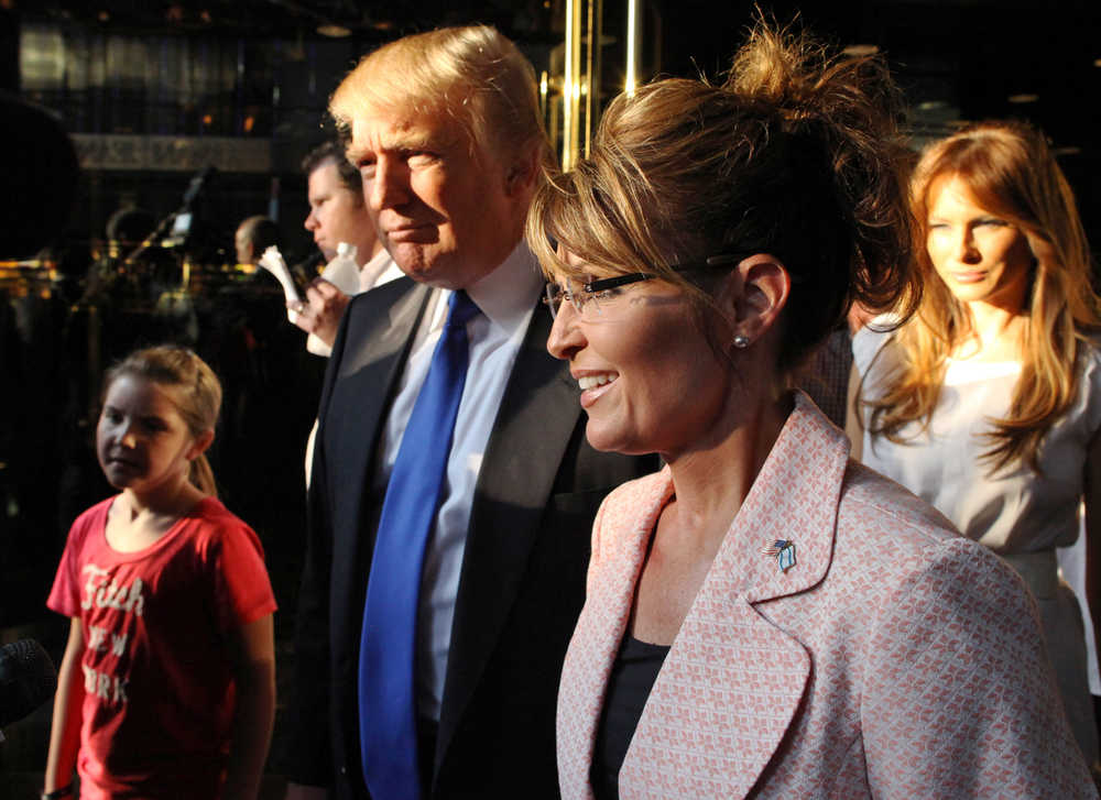 In this May 31, 2011 photo, Donald Trump walks with former governor of Alaska Sarah Palin in New York City. The Republican presidential front-runner Trump received a key endorsement from conservative heavyweight Sarah Palin on Tuesday.