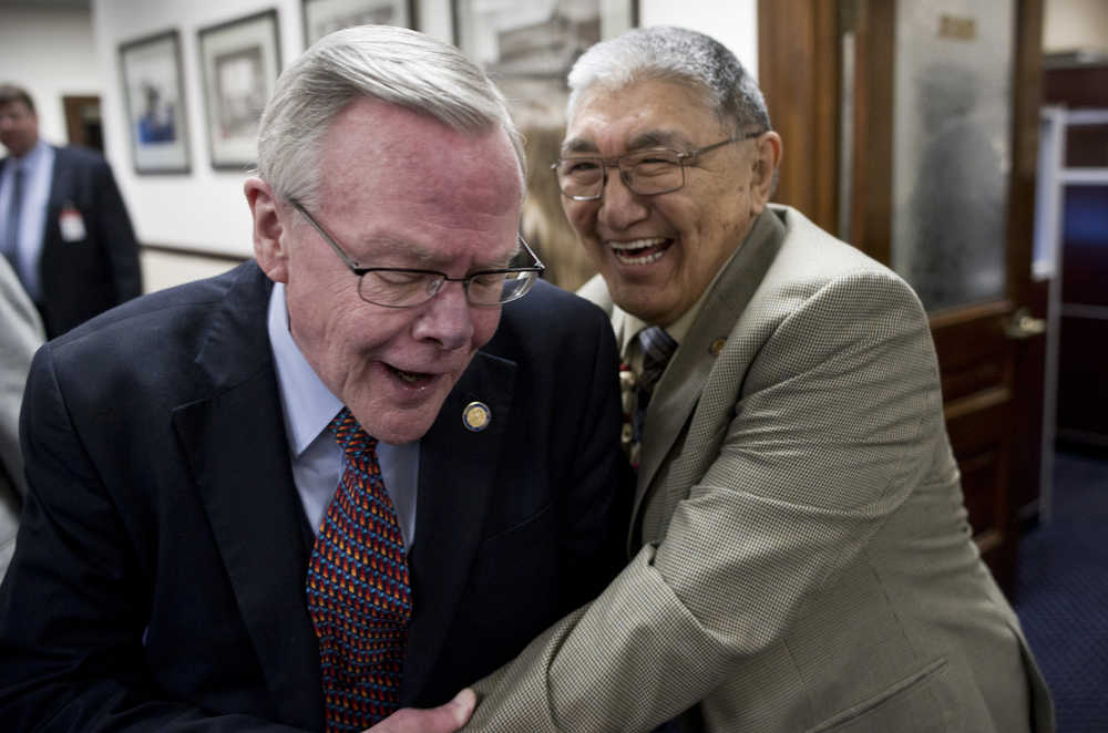 Sen. Dennis Egan, D-Juneau, left, receives an enthusiastic greeting by Rep. Benjamin Nageak, D-Barrow, on the first day of the 29th Legislature at the Capitol in Juneau on Tuesday, Jan. 19, 2016.