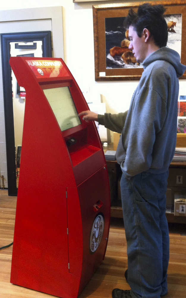 In this Sept. 30, 2014 photo, Greg Klupar interacts with a kiosk which could be used to dispense raffle and lottery tickets to buyers in Skagway.