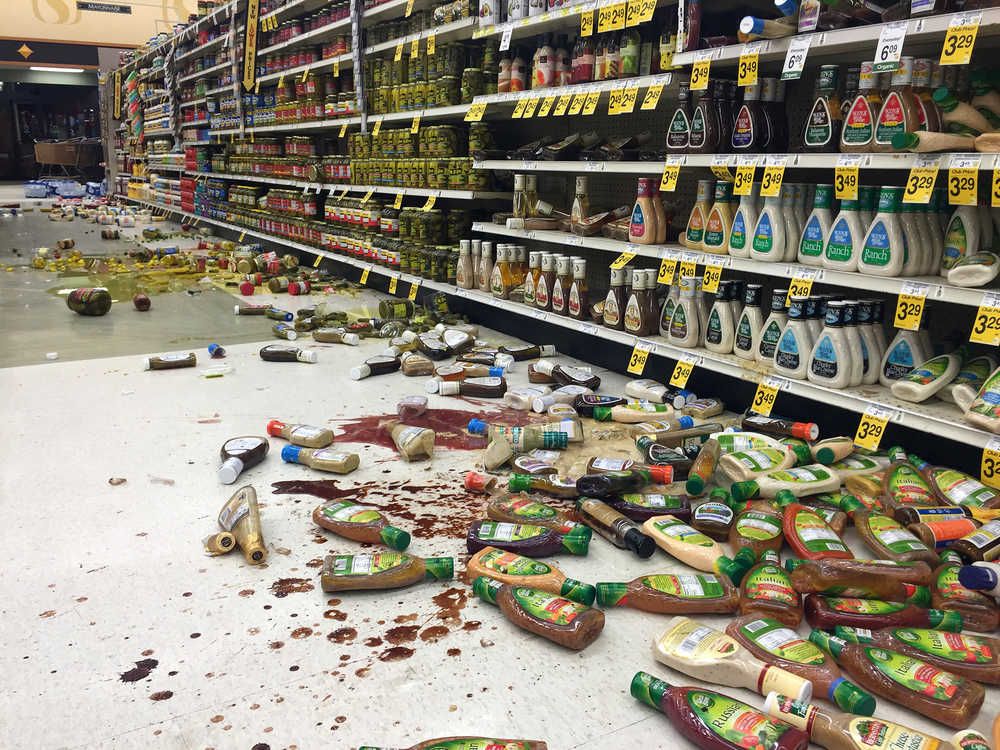 In this photo provided by Vincent Nusunginya, items fallen from the shelves litter the aisles inside a Safeway grocery store following an earthquake on the Kenai Peninsula on Sunday.