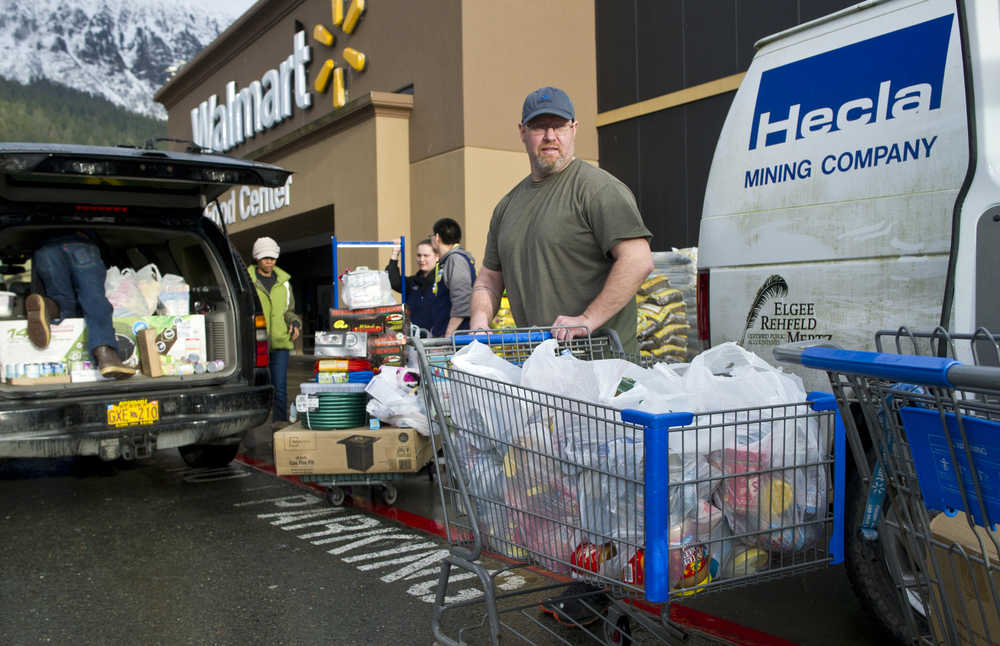 Darren Adams, manager of the Southeast Alaska Food Bank, takes advantage of the store-closing sales at Walmart to buy thousands of pounds of food for the Southeast Food Bank on Friday.