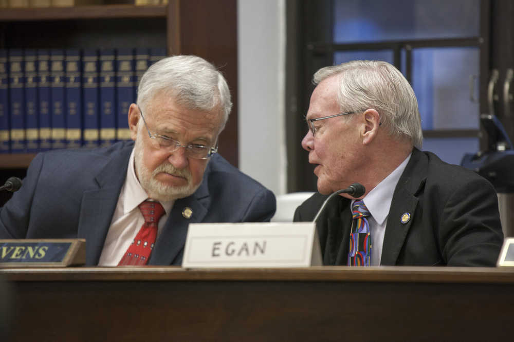 In this photo from Sunday,  Sen. Gary Stevens R-Kodiak, left, and Sen. Dennis Egan, D-Juneau, confer during a discussion on Lunch and Learn events at a Legislative Ethics committee meeting.