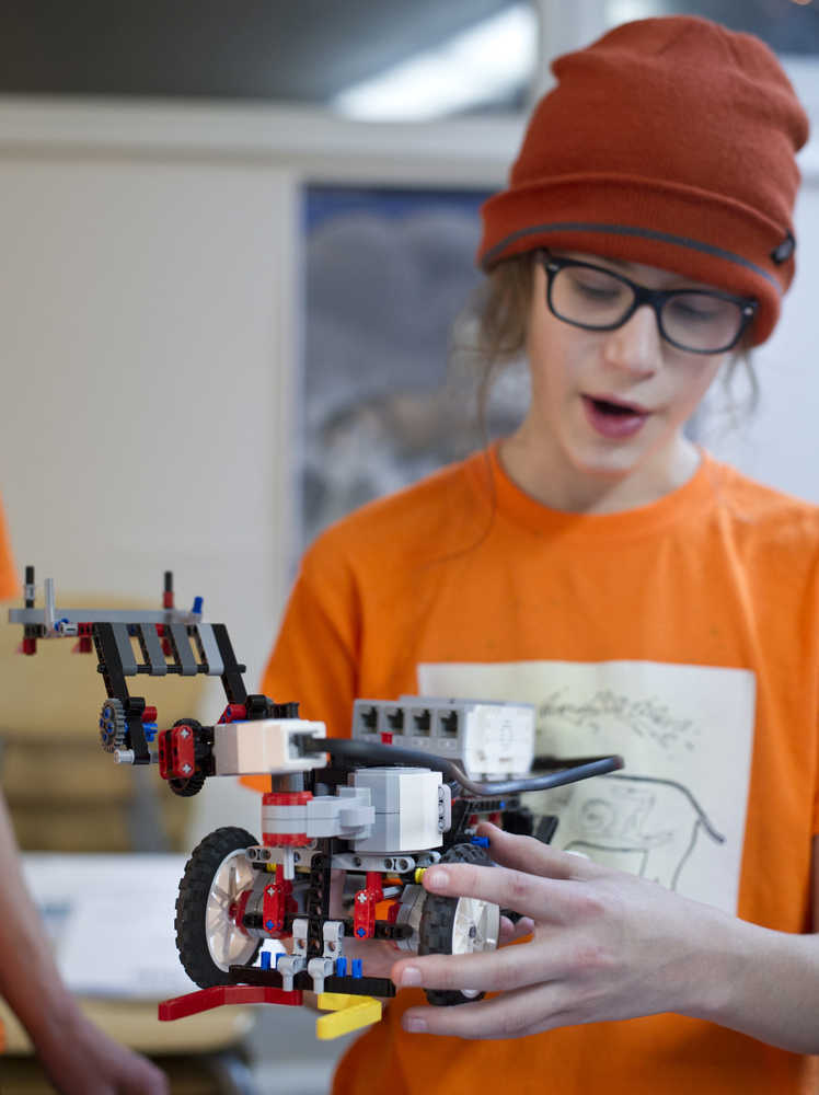 Ambrose Bucy, 13, explains how he built the main body of the robot for his team's recent Lego League competitions.