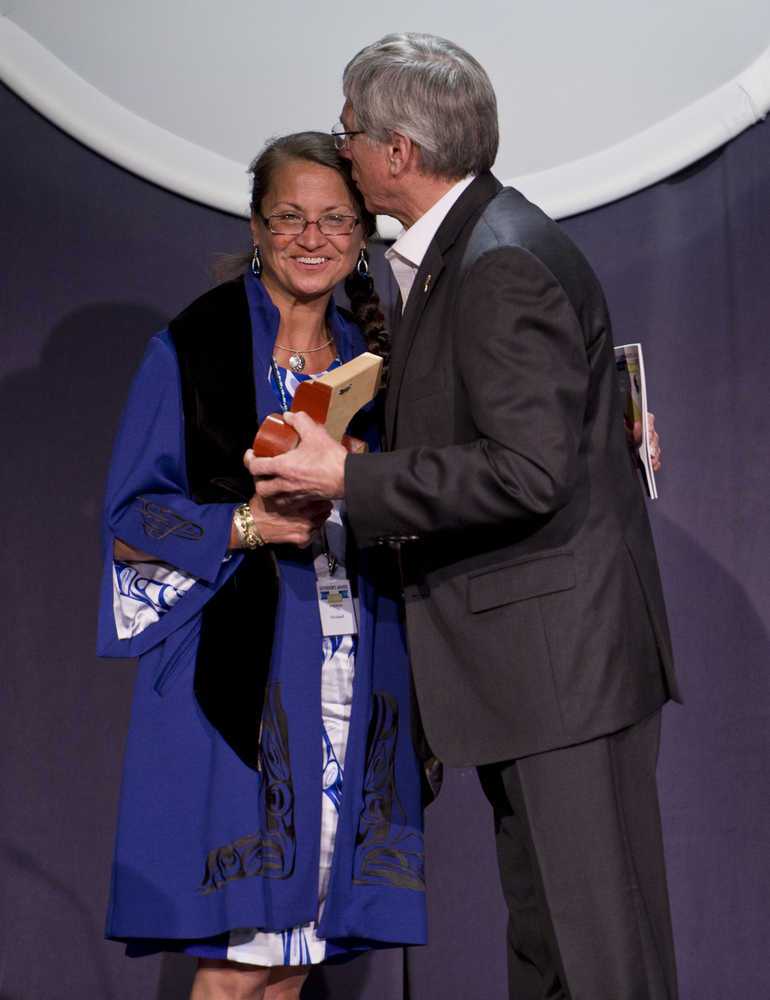 Margaret Nick Cooke Award for Alaska Native Arts and Languages winner Vicki Soboleff receives her award and a kiss from Lt. Gov. Byron Mallott during the 2016 Governor's Awards for the Arts & Humanities held at the Juneau Arts & Culture Center in Juneau on Jan. 28.