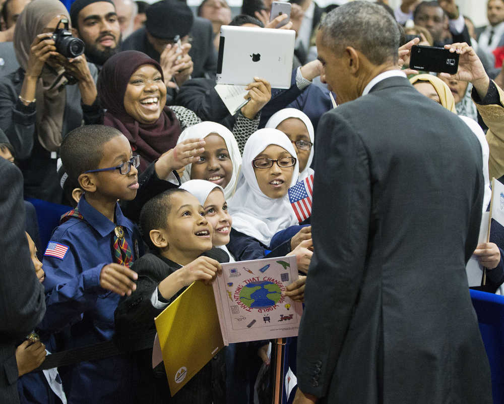 President Barack Obama stops to greets children from Al-Rahmah school and other guests during his visit to the Islamic Society of Baltimore, Wednesday, Feb. 3, 2016, in Baltimore, Md. Obama is making his first visit to a U.S. mosque at a time Muslim-Americans say they're confronting increasing levels of bias in speech and deeds.(AP Photo/Pablo Martinez Monsivais)