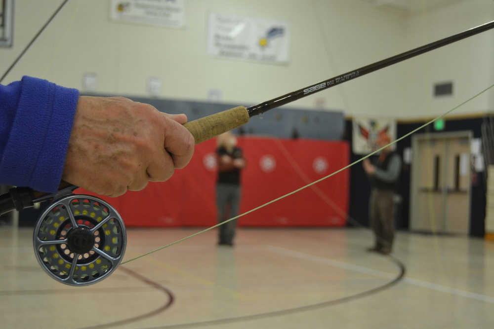 Raincountry Flyfishers president Tony Soltys demonstrates a flyfishing grip at a March 2014 class.