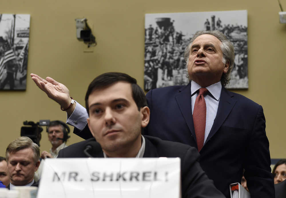 Benjamin Brafman, right, attorney for pharmaceutical chief Martin Shkreli, foreground, speaks  on Capitol Hill in Washington, Thursday, Feb. 4, 2016, during a House Committee on Oversight and Reform Committee hearing on rising drug prices.  Shkreli refused to testify before U.S. lawmakers who excoriated him over severe hikes for a drug sold by a company that he acquired.  (AP Photo/Susan Walsh)