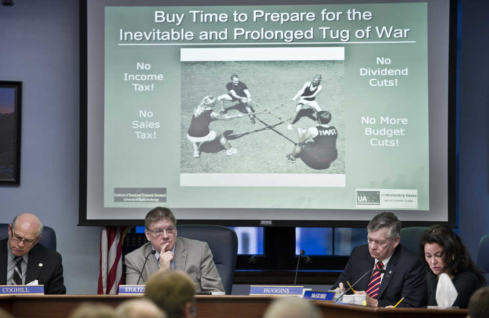Senate State Affairs Committee members John Coghill, R-North Pole, left, Bill Stoltze, R-Chugiak, Charlie Huggins, R-Wasilla, and Lesil McGuire, R-Anchorage, listen to UAA Professor Emeritus in Economics, Scott Goldsmith about possible budget solutions during a hearing for SB 128 at the Capitol on Thursday.