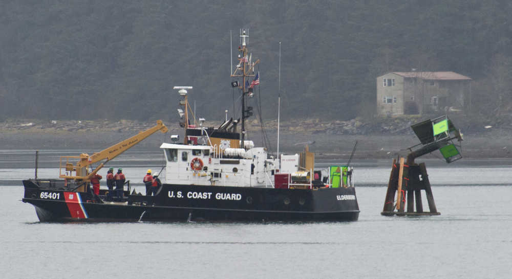 The U.S. Coast Guard Buoy Tender Elderberry arrives to remove a broken light in Gastineau Channel on Monday. The crew of the Elderberry, based in Petersburg, came specifically to repair the light that was struck by a tug in November.