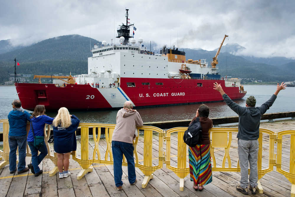 People watch the arrival of the polar icebreaker U.S. Coast Guard Cutter Healy at the cruise ship terminal in September 2014. The Healy was returning to Seattle after completing 123 days of operations in the Bering Sea, Chukchi Sea and Arctic Ocean.