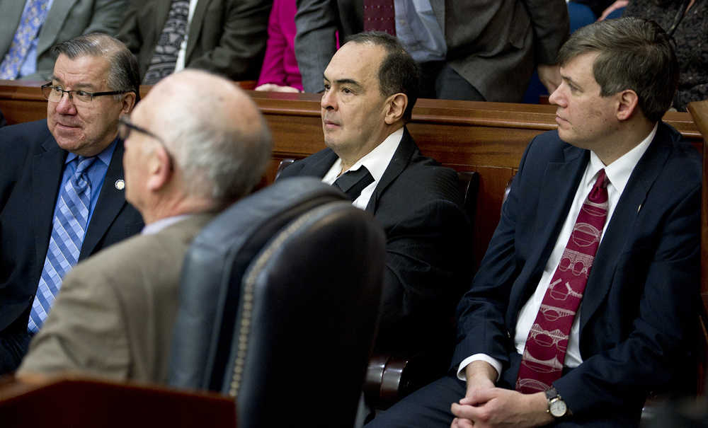 Sen. Donald Olson, D-Golovin, center, sits between Sen. Bill Wielechowski, D-Anchorage, right, and Sen. Lyman Hoffman, D-Bethel, left, and Rep. Steve Thompson, R-Fairbanks, foreground, to watch the State of the Judiciary speech at the Capitol on Wednesday. Sen. Olson announced his move to the Republican-controlled Senate majority caucus Wednesday.