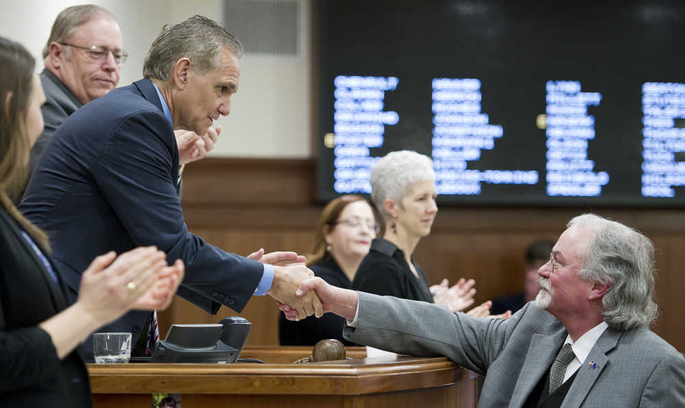 Craig Stowers, Chief Justice of the Alaska Supreme Court, right, shakes hands with Senate President Kevin Meyer, R-Anchorage, center, and Speaker of the House Mike Chenault, R-Nikiski, after his State of the Judiciary speech to a Joint Session of the Alaska Legislature at the Capitol on Wednesday.