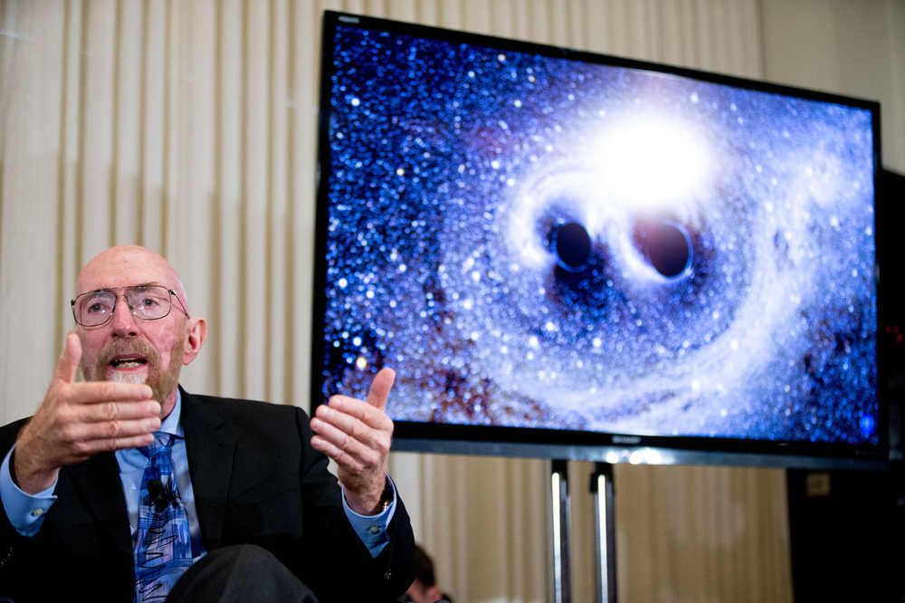 Laser Interferometer Gravitational-Wave Observatory (LIGO) Co-Founder Kip Thorne speaks next to a visual of gravitational waves from two converging black holes, right, during a news conference at the National Press Club in Washington, Thursday, Feb. 11, 2016, to announce that scientists they have finally detected gravitational waves, the ripples in the fabric of space-time that Einstein predicted a century ago. The announcement has electrified the world of astronomy, and some have likened the breakthrough to the moment Galileo took up a telescope to look at the planets. (AP Photo/Andrew Harnik)