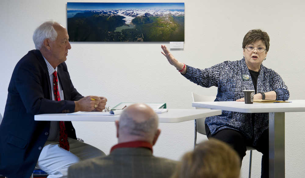 Juneau mayorial candidates Karen Crane and Ken Koelsch answer questions during a forum held by the Downtown Business Association in the Senate Building on Friday.