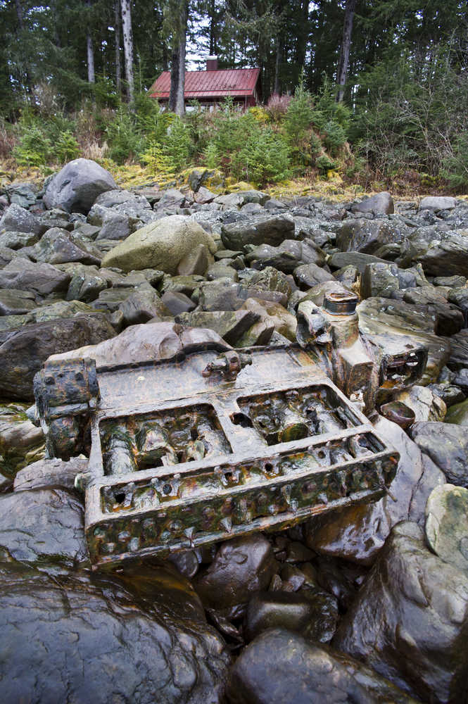 The rusted remains of a six-cylinder, 1928 Buick engine, sits on the beach in front of Ernest Gruening's cabin near Amalga Harbor. The engine powered the the Ark of Juneau, a boat built by the Satko family that brought them to Juneau in the summer of 1938.