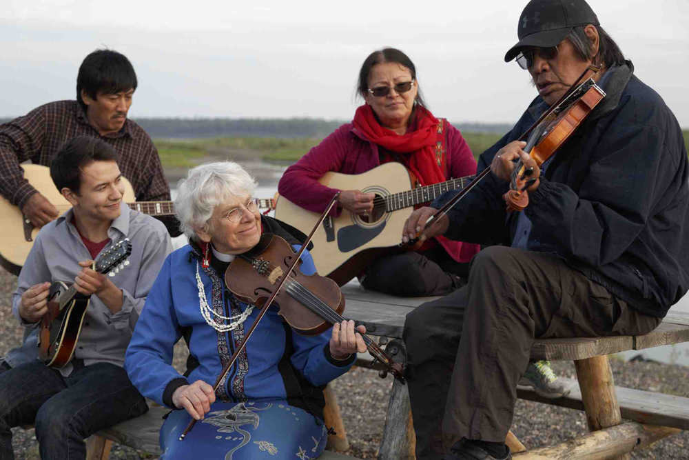 Dancing with the Spirit staff members (left to right) Bobby Gilbert, Kelly May, Belle Mickelson, Josephine Malemute, and Trimble Gilbert jam along the banks of the Yukon River in northern Alaska.
