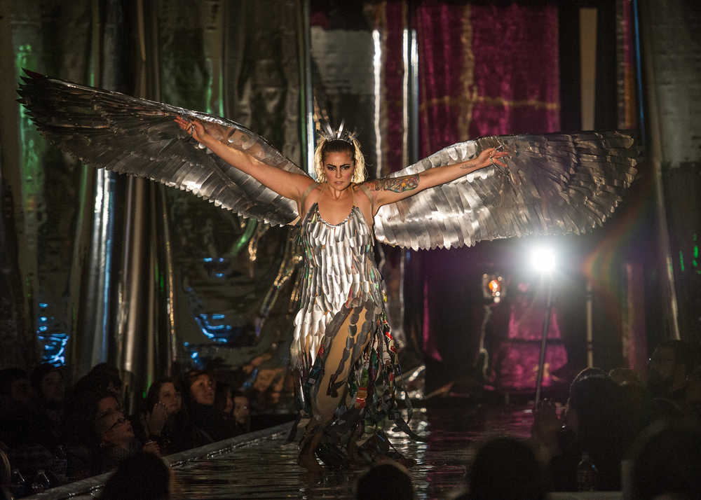 Adriane Honerbrink models her "Aluminum Raven" made of recycled aluminum cans, pvc pipe and recycled fabric at the Wearable Art Extravaganza 2016 at Centennial Hall on Sunday.
