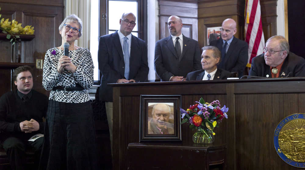 Kayla Epstein, widow of Rep. Max Gruenberg, D- Anchorage, speaks at a memorial in honor of her husband at the Capitol on Tuesday. Gruenberg, 72, died on Sunday at his home in Juneau. Ted Madsen, left, staff to Rep. Gruenberg, is show attending with Rep. Andy Joesphson, D-Anchorage, Rep. Adam Wool, D-Fairbanks, Senate President Kevin Meyer, R-Anchorage, Rep. Daniel Ortiz, I-Ketchikan, and Speaker of the House Mike Chenault, R-Nikiski, right.