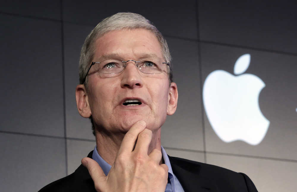 FILE - In this April 30, 2015, file photo, Apple CEO Tim Cook responds to a question during a news conference at IBM Watson headquarters, in New York. Cook said his company will resist a federal magistrate's order to hack its own users in connection with the investigation of the San Bernardino, Calif., shootings. In a statement posted early Wednesday, Feb. 17, 2016, on the company's website, Cook argued that such a move would undermine encryption by creating a backdoor that could potentially be used on other future devices. (AP Photo/Richard Drew, File)