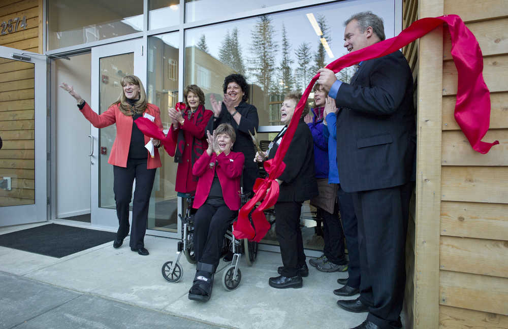 Dignitaries celebrate a ribbon cutting during the grand opening of the Terraces at Lawson Creek housing facility on Douglas Island on Wednesday. Phase one, with 40 units, was recently completed with one, two and three-bedroom units with an on-site community center. Groundbreaking for phase two is expected this spring for another 35 units.The project is run by Volunteers of America Alaska and received additional funding from the Alaska Housing Fnance Corporation and the Rasmuson Foundation. From left: Robin Keller, of Volunteer of Amercia Inc., Sen. Lisa Murkowski, Diane Kaplan, CEO of the Rasmuson Foundation, Mayor Mary Becker, Elaine Dahlgren, President/CEO of Volunteers of American Alaska, Debbie Boiney, of the Rasmuson Foundation, and Bryan Butcher, CEO of the AHFC.