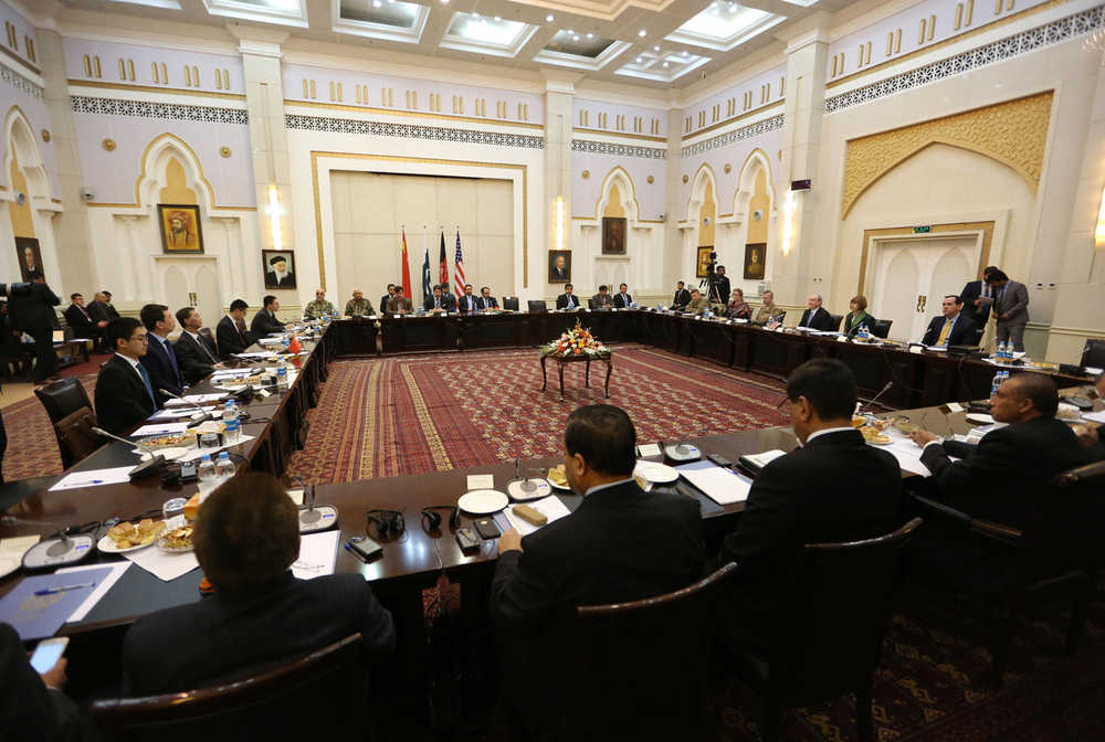Delegations from Afghanistan, Pakistan, the U.S. and China discuss a road map for ending the war with the Taliban on Tuesday at the Presidential Palace in Kabul, Afghanistan.