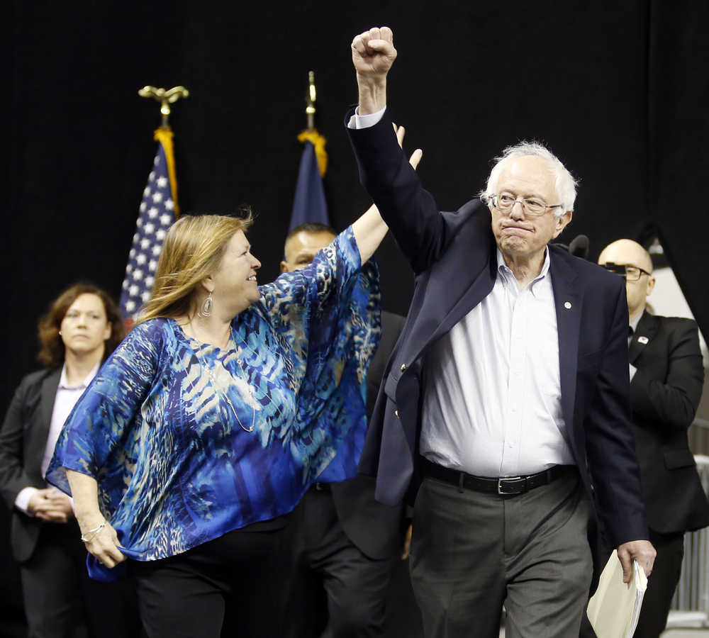 Democratic presidential candidate, Sen. Bernie Sanders, I-Vt., right, and his wife, Jane arrive for a rally in Norfolk, Va., Tuesday, Feb. 23, 2016.  (AP Photo/Steve Helber)