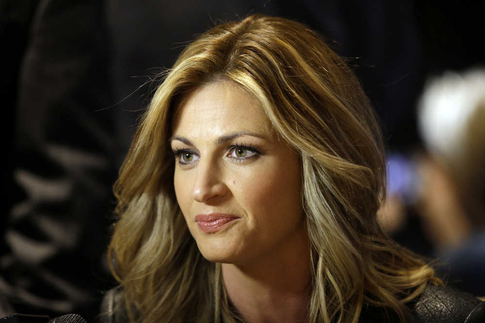 FILE - In this Jan. 28, 2014, file photo, sportscaster Erin Andrews speaks during an interview at the NFL Super Bowl XLVIII media center in New York. An attorney for Andrews told a jury Tuesday, Feb. 23,2016, that she felt horror, shame and humiliation when she discovered that someone had secretly filmed her nude and posted the video on the Internet.  (AP Photo/Matt Slocum, File)