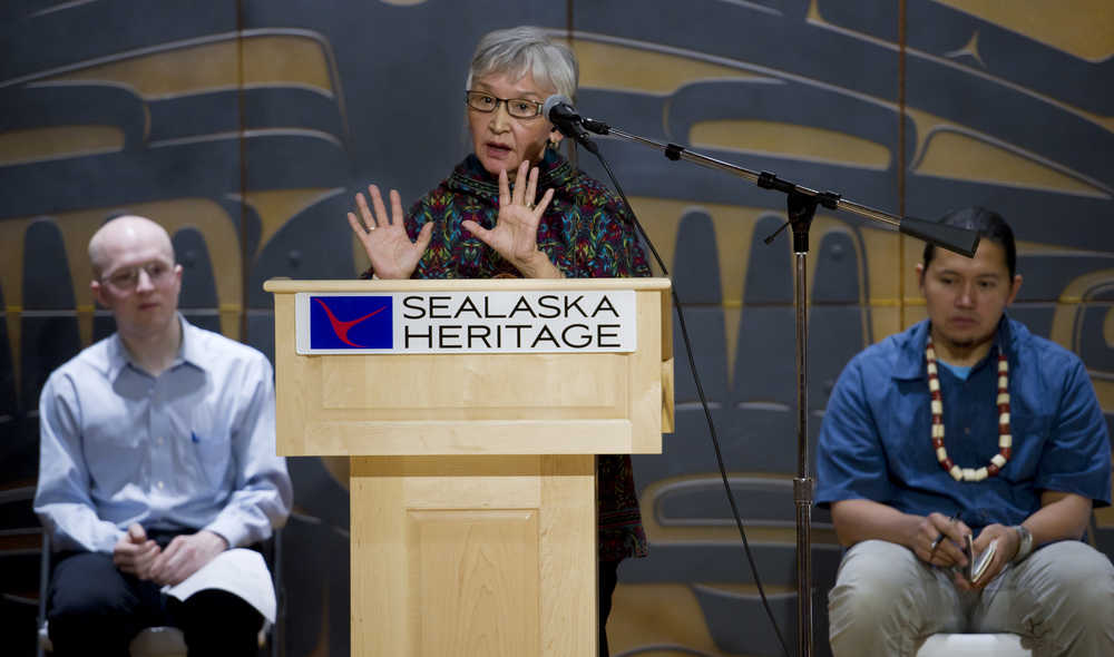 Edna MacLean, Commissioner of Iñupiat History, Language, and Culture for the North Slope Borough, speaks at the Alaska Language Summit at the Walter Soboleff Building on Tuesday. Rep. Jonathan Kreiss-Tomkins, D-Sitka, left, and X̱unei Lance Twitchell, Assistant Professor of Alaska Native Languages at the University of Alaska Southeast, listen on stage in the Shuká Hit Clan House.