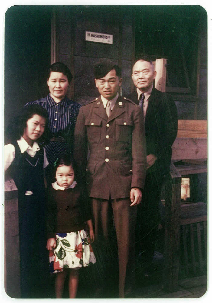 In this 1945 photo, members of the Tanaka family stand together at the Minidoka Japanese internment camp in Jerome, Idaho, where they were held in forced incarceration during World War II. Alice Tanaka Hikido, left, and her sister, Mary Tanaka Abo, the child in the foreground, participated in a Feb. 19 ceremony at Joint Base Elmendorf-Richardson that was held to remember the forced incarceration of more than 200 Alaskans, as well unveil the results of a study about a little-known Japanese internment camp that was erected there during World War II. Also pictured are Nobu Tanaka, back left, John Tanaka, in uniform second from right, standing next to Shonosuke Tanaka.