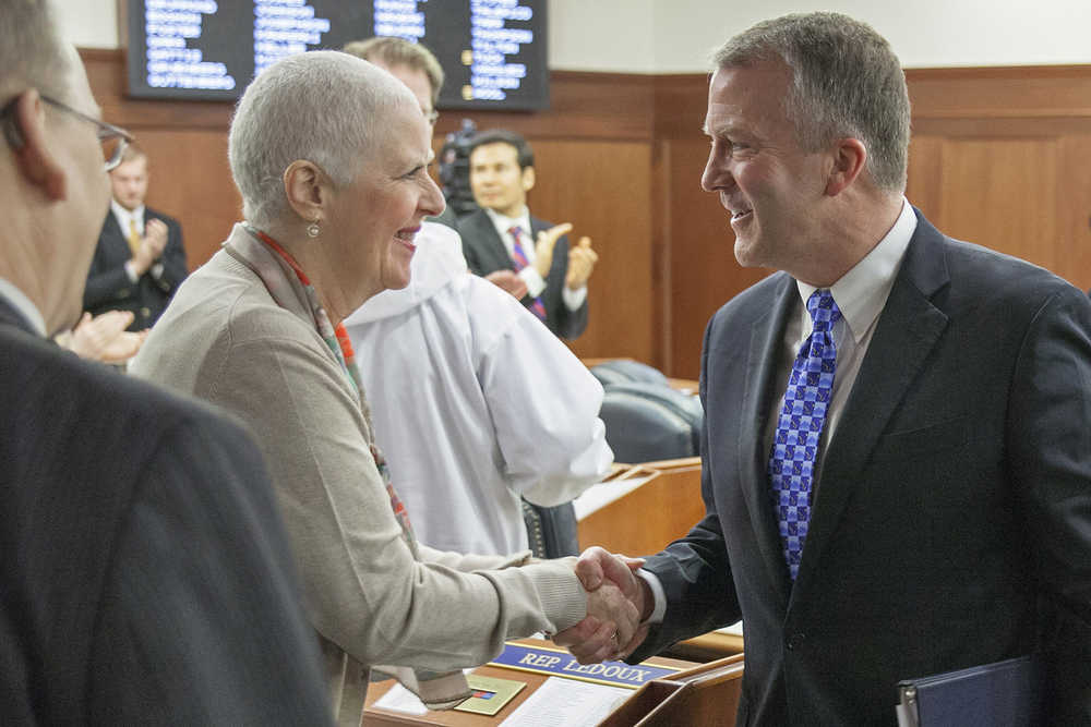 Rep. Louise Stutes, R-Kodiak, greets U.S. Sen. Dan Sullivan after his annual address to a joint session of the Alaska Legislature on Monday, Feb. 29, 2016, in Juneau, Alaska. The Republican Senator spoke of challenges facing Alaska and the U.S. as oil prices continue to fall and military activity in the Arctic grows. (AP Photo/Rashah McChesney)